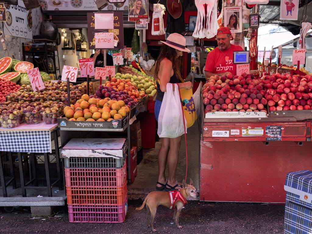 An Israeli woman shops with her dog at the Carmel market in Tel Aviv, on August 7, 2024, amid regional tensions during the ongoing war between Israel and the Palestinian Hamas movement in the Gaza Strip.
Oren ZIV / AFP